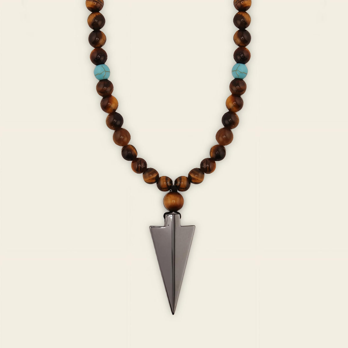 Vector Calm Necklace with brown stone beads and a pointed metal pendant
