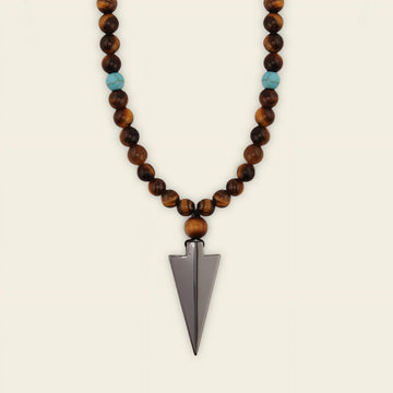 Vector Calm Necklace with brown stone beads and a pointed metal pendant