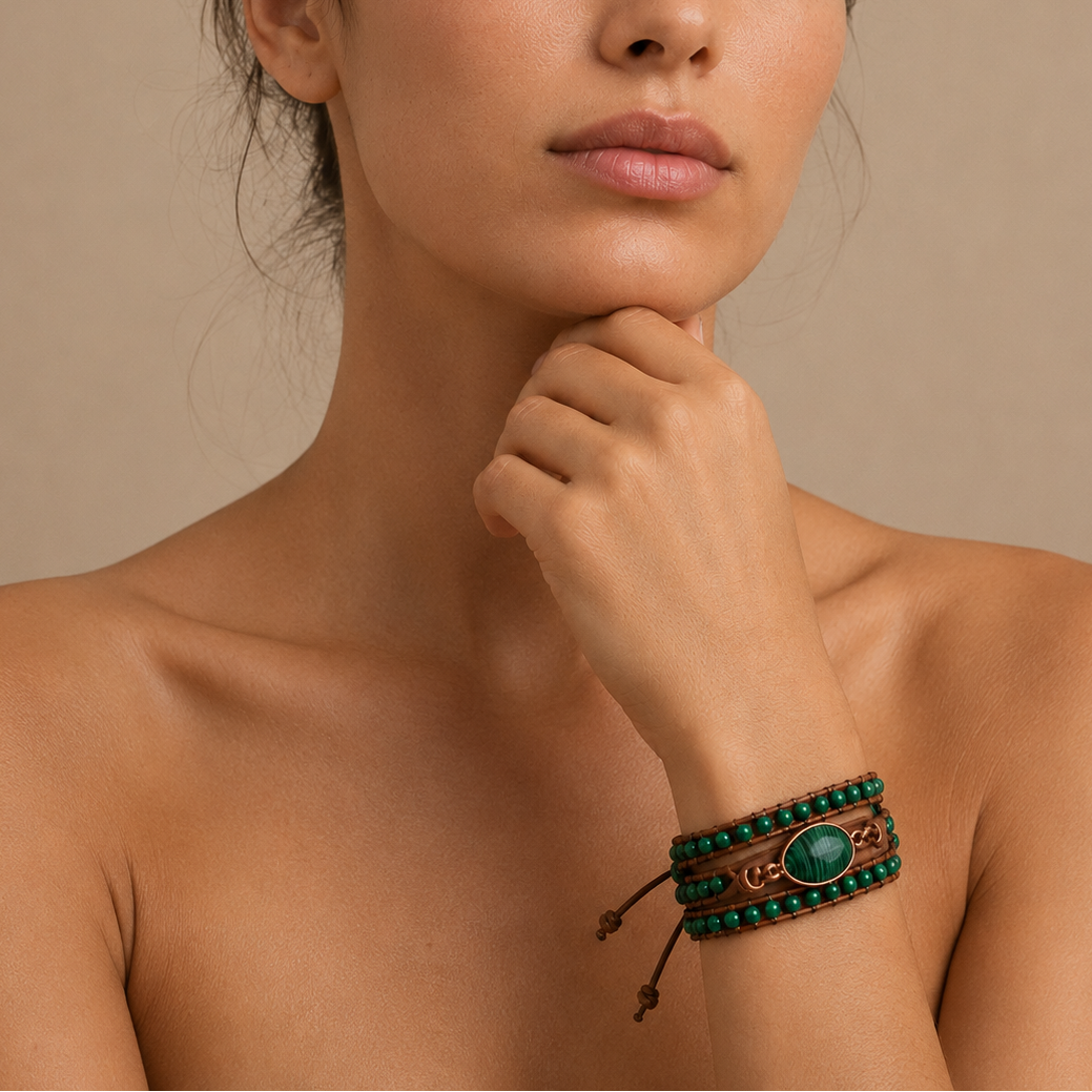 Verdant Hold Bracelet worn on the wrist, with layered green beads on brown cord