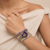 Violet Wrap Bracelet worn on the wrist, with layered pale and purple bead strands