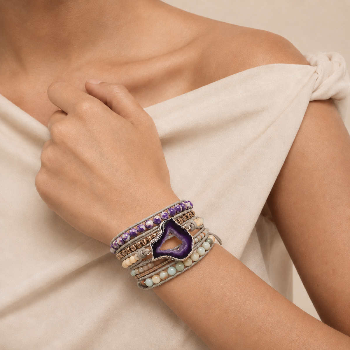 Violet Wrap Bracelet worn on the wrist, with layered pale and purple bead strands