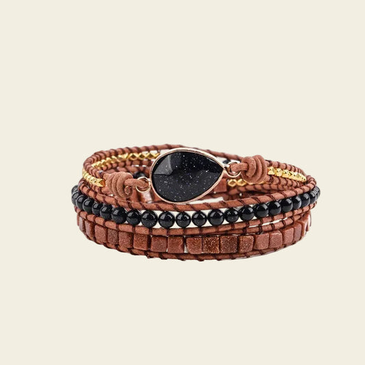 Midnight Ember Bracelet with dark and earth-toned beads on brown cord